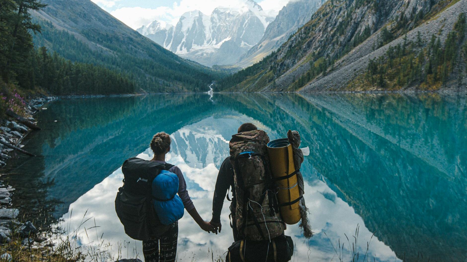 couple standing near lake